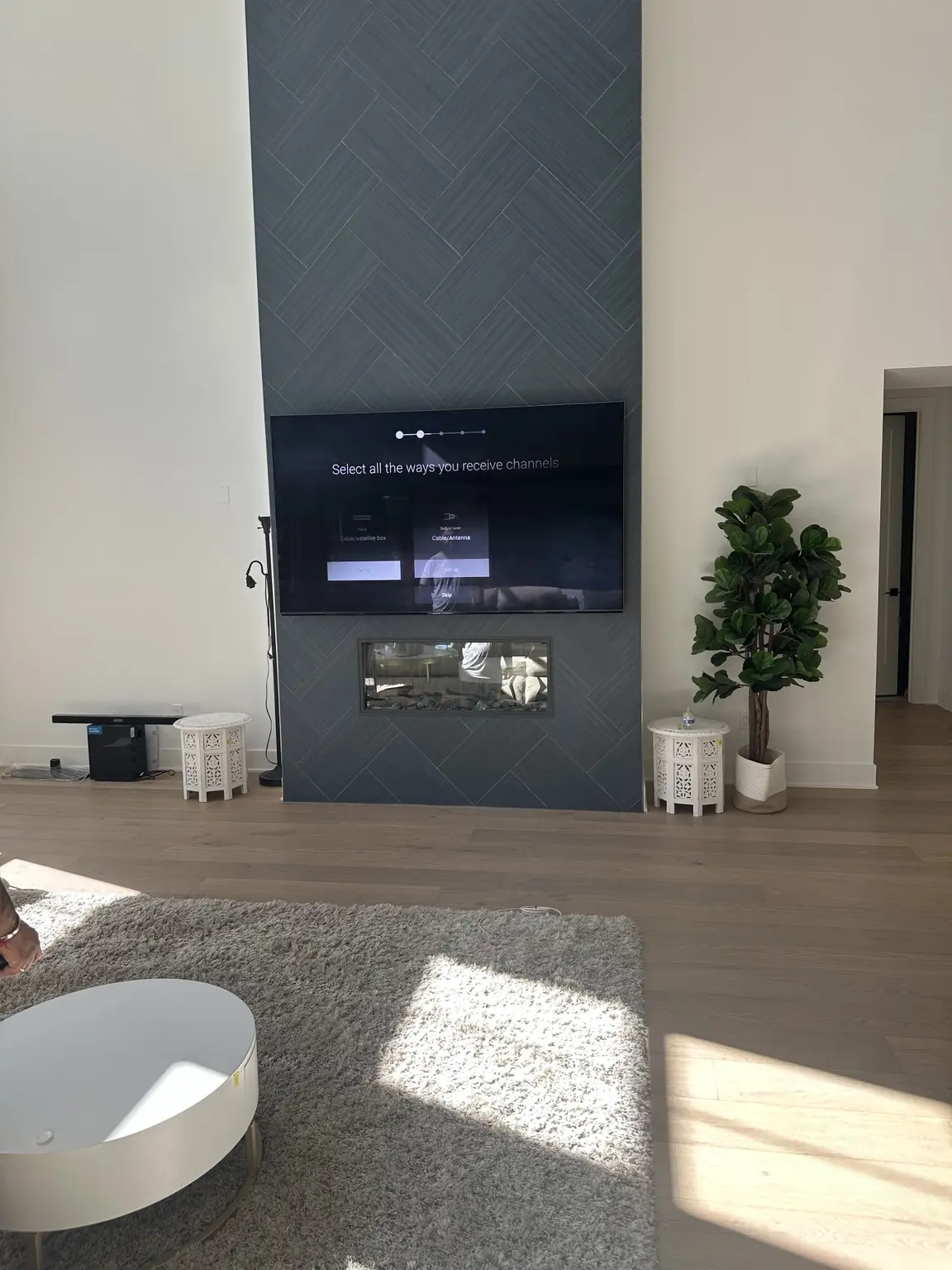 Completed floor-to-ceiling fireplace and media wall